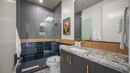 a bathroom with a toilet and a shower and a sink at Montclair at Zion in Springdale