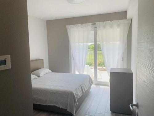 Ένα ή περισσότερα κρεβάτια σε δωμάτιο στο SirmioGarda House