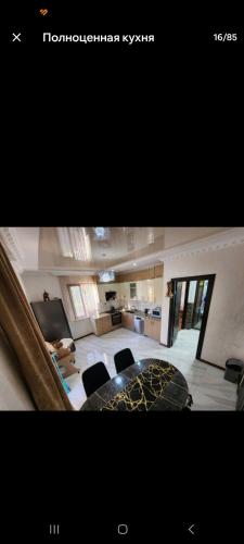 a view of a living room with chairs and a living room at mado house in Chakvi