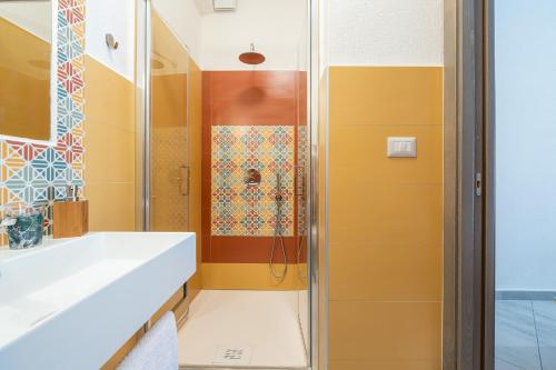 a bathroom with a shower and a sink at Affittacamere Marizzola in Cala Gonone