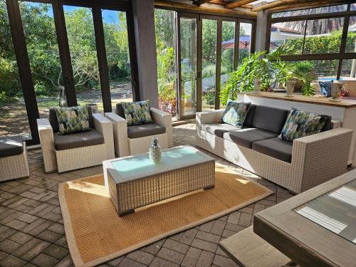 a living room with couches and a coffee table at The Manor in Velddrif