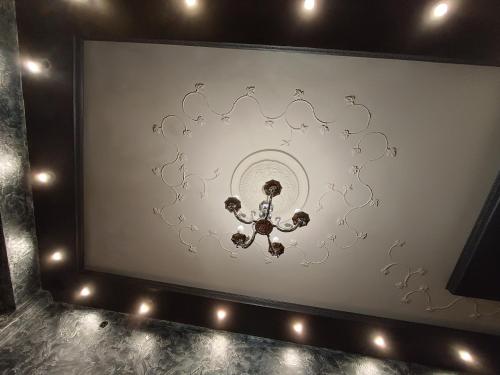 a television screen with a picture of a chandelier at Martina 1 in Budva
