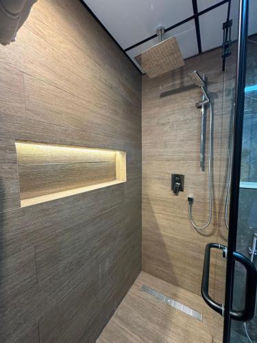 a bathroom with a shower with a glass door at 5 Star Comfort - Luxury Sea View in Ajman
