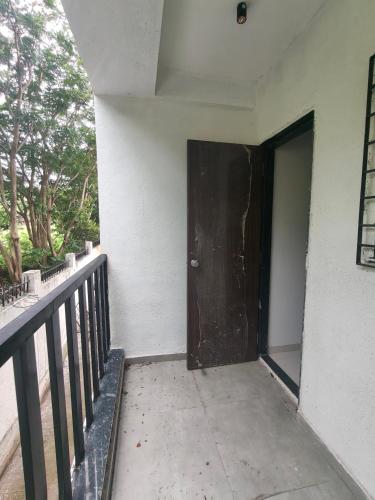 a door on the side of a building at Amrutyog homes in Wai