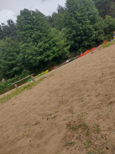 a race track with flags on a dirt field at Positive energy 2 in Sulejów