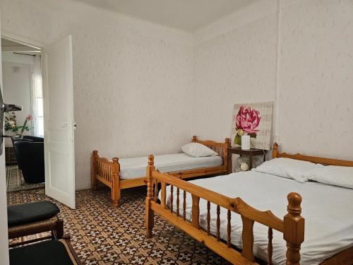 Postel nebo postele na pokoji v ubytování Les cigognes
