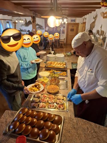 a group of people wearing rubber ducky people preparing food at Jugendherberge Bayrischzell-Sudelfeld in Bayrischzell