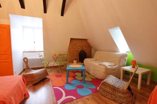 a living room with a couch and a table at Domaine Garmidou in Lucq-de-Béarn