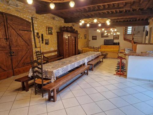 a large room with a large bed in a building at Domaine Garmidou in Lucq-de-Béarn