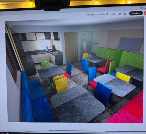 a room with colorful chairs and tables in a room at Sieglinde Color in Sölden
