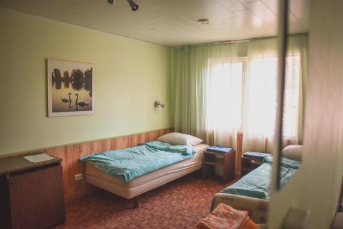 Postel nebo postele na pokoji v ubytování Metsa Hostel