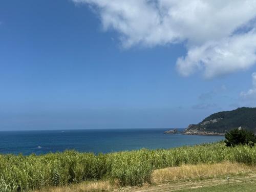 a view of the ocean from a hill at Ca Mestral Espasante San Antonio - Vistas espectaculares in Porto de Espasante