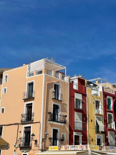 a tall building with balconies on the side of it at H&B COSTABLANCA in Villajoyosa