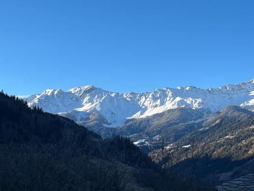 a view of a mountain range with snow covered mountains at Bed and Breakfast Il Cardellino in San Carlo