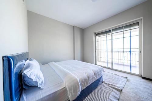 Postel nebo postele na pokoji v ubytování شقق التجوري Al-Tjouri Apartments