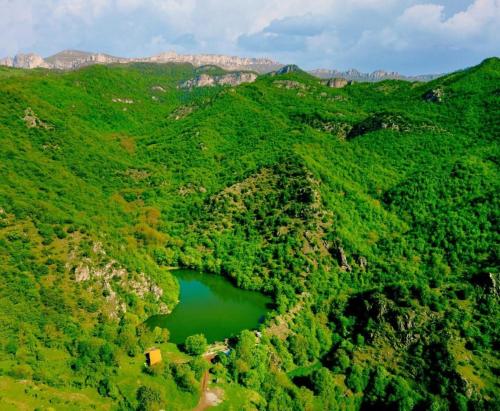 an aerial view of a mountain with a lake at Hovk Guesthouse in Hovkʼ