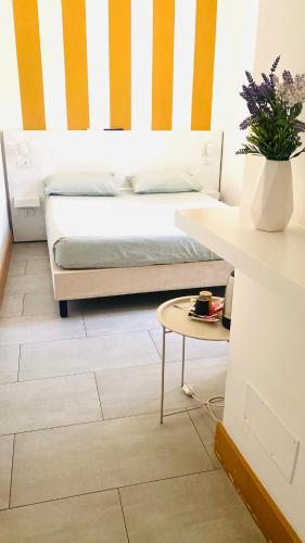 a bedroom with a bed and a table at Guest House S Caterina in Viterbo