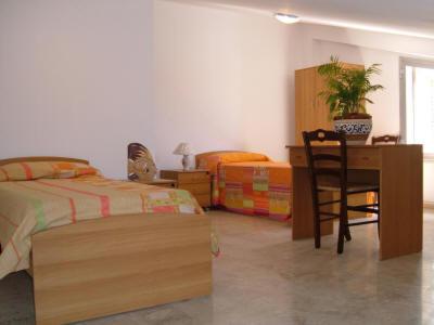 Ένα ή περισσότερα κρεβάτια σε δωμάτιο στο Taormina Bay Lucia's House 4