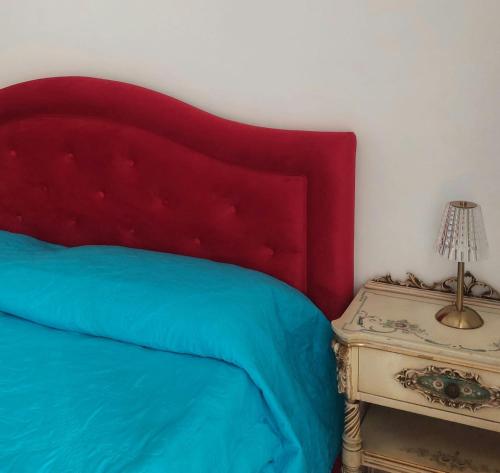 Un pat sau paturi într-o cameră la palazzo sardanelli camera