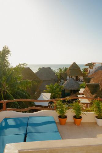 a view of the ocean from a resort patio at Casa Las Tortugas Petit Beach Hotel & Spa in Holbox Island