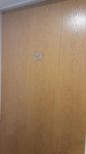 a brown door with the number on it at Elegant three bedroom apartment in Darlington