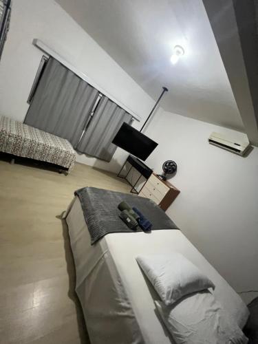 Ένα ή περισσότερα κρεβάτια σε δωμάτιο στο Casa camburi