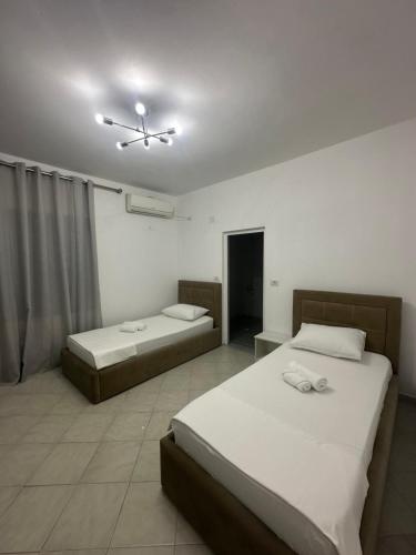 Ένα ή περισσότερα κρεβάτια σε δωμάτιο στο Gold Rooms I