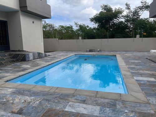 a swimming pool in a yard next to a house at Blaclava Retreat in Balaclava