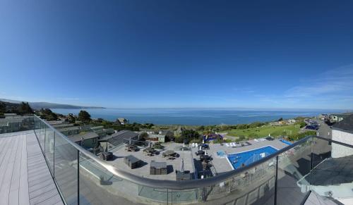 an aerial view of a resort with a swimming pool at Hendre Coed Isaf Caravan Park in Barmouth