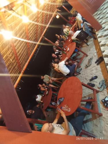 a group of people on a ride in a gym at Three Ken Homestay & Cafe in Manado