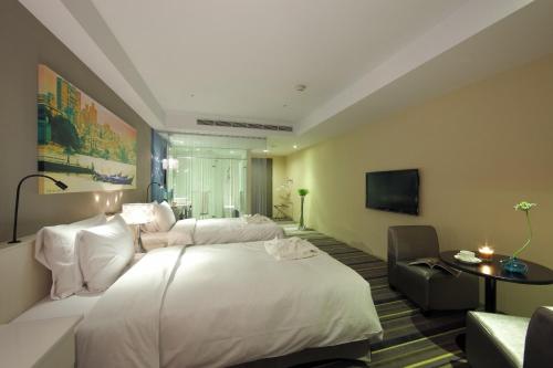 Hotelday Tamsuiにあるベッド