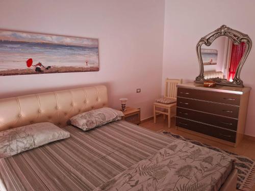 Voodi või voodid majutusasutuse Sunlight Apartment Shkoder toas