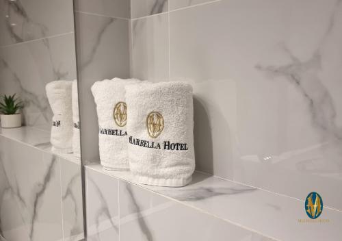 two towels on a shelf in a bathroom at Marbella Hotel in Jounieh