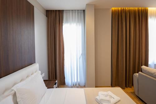 Ένα ή περισσότερα κρεβάτια σε δωμάτιο στο Infinity Apartments