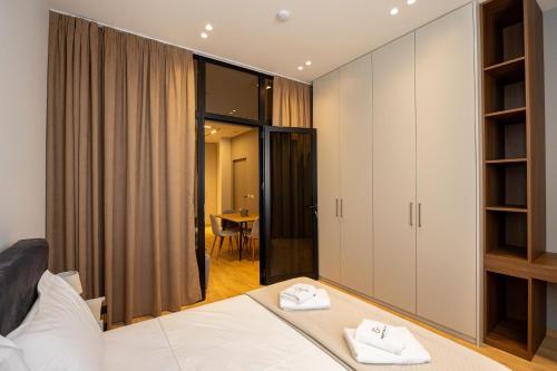 Ένα ή περισσότερα κρεβάτια σε δωμάτιο στο Infinity Apartments