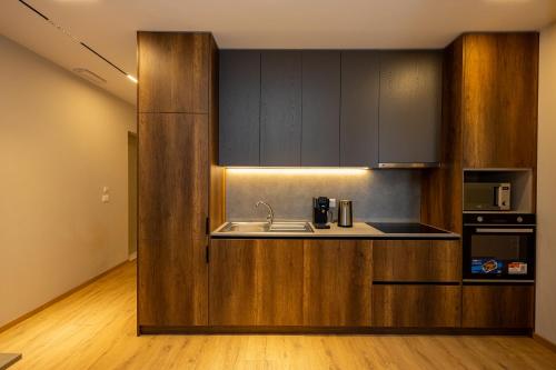 Η κουζίνα ή μικρή κουζίνα στο Infinity Apartments