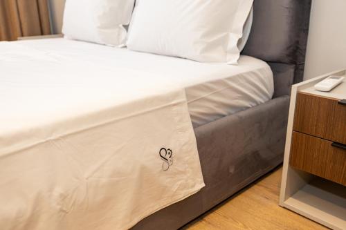 Ένα ή περισσότερα κρεβάτια σε δωμάτιο στο Infinity Apartments