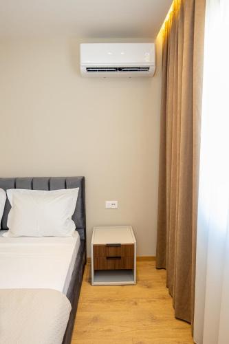 Ένα ή περισσότερα κρεβάτια σε δωμάτιο στο Infinity Apartments