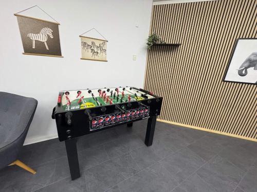a foosball table in the corner of a room at 4 star holiday home in Nørre Nebel in Nørre Nebel