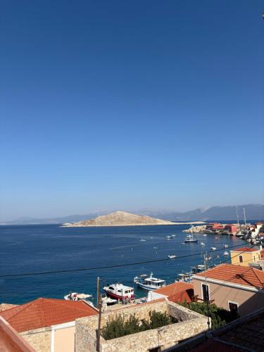 a view of a harbor with boats in the water at Aegean soul apartment in Halki
