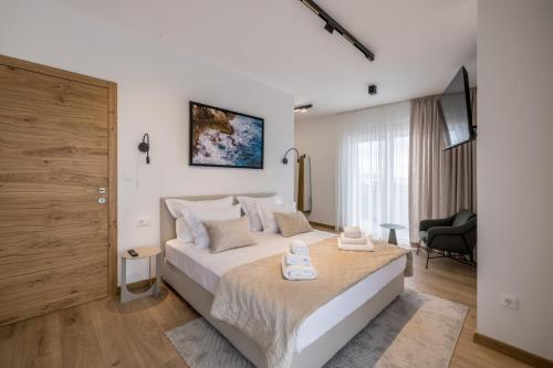 a bedroom with a large white bed in a room at Villa Azzura in Vodice