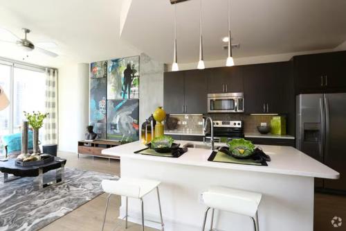 a kitchen with a large white island in a room at Spacious Luxury 1bedroom 1bath Pool in Austin