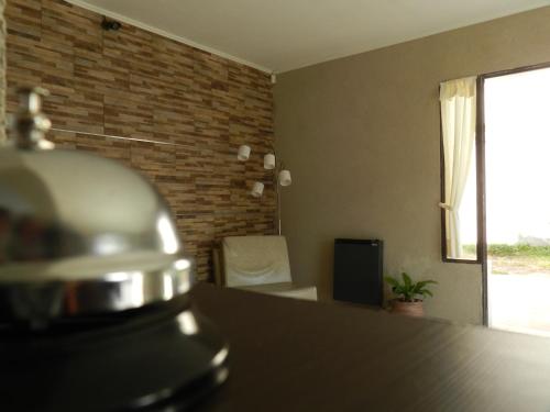 a room with a counter top and a window at Hotel El Parque in San Clemente del Tuyú