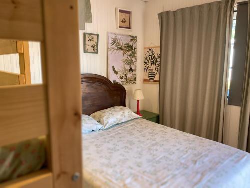 a bedroom with a bed and a window at Quinta da Maínha - Charming Houses - Escape to Nature in Braga