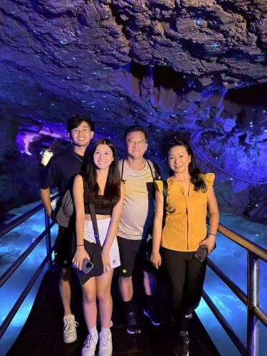 a group of people posing for a picture in a cave at Easy House in Zhangjiajie