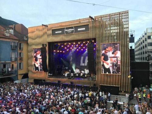 a large crowd of people in front of a stage at 1-bedroom apartment in Losone