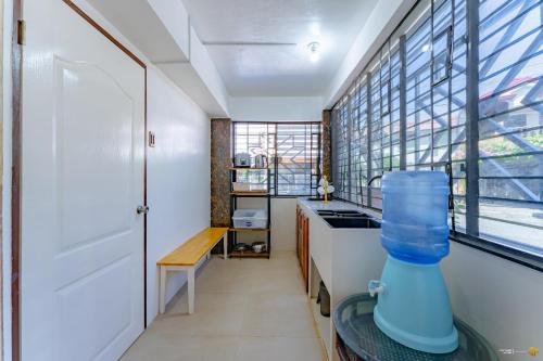 a kitchen with a sink and a window at Ideal place to stay for 8-12pax with Parking Area in Mactan Island