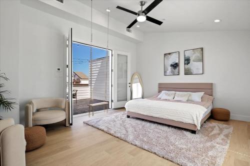 a bedroom with a bed and a ceiling fan at The Loftline in Dallas