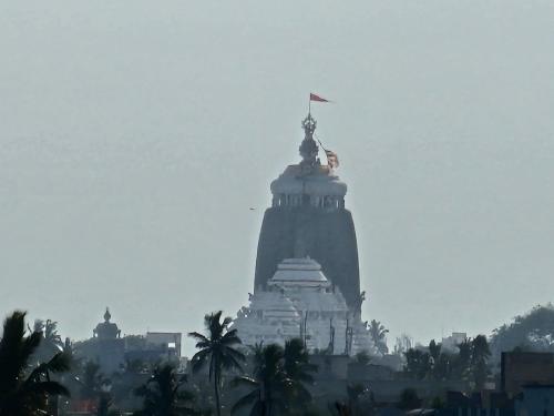a large building with a statue on top of it at NIRMAN HOMESTAY 5 minutes walk to beach in Puri