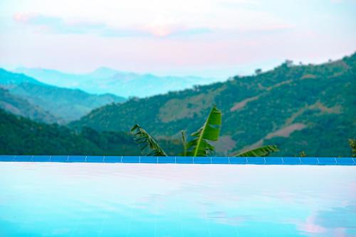 a swimming pool with a view of mountains at Quinta Maka VistaHermosa in Villeta